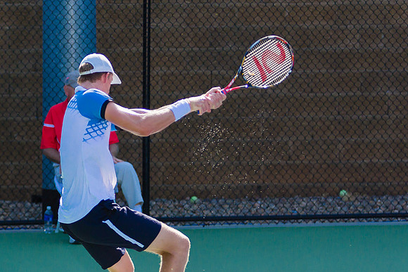 Kevin Anderson follows through at the Winston-Salem Open