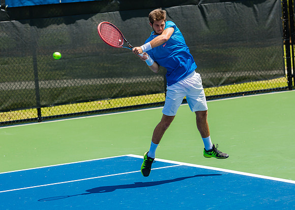 Keivon Tabrizi smashes a back-hand at the Winston-Salem Open