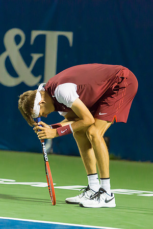 Jared Donaldson leans on his racquet at the Winston-Salem Open