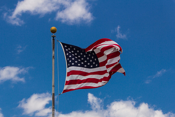 American Flag Ruffling with Clouds and Blue Sky