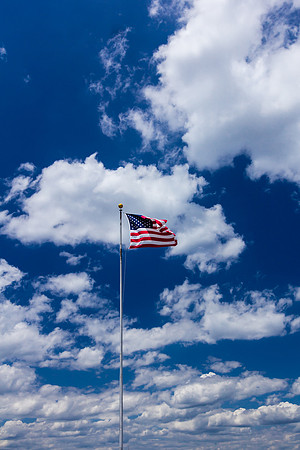 American Flag Against Beautiful Blue Sky