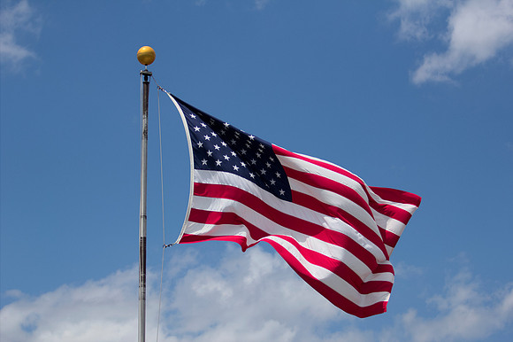 American Flag Close-up with Blue Sky