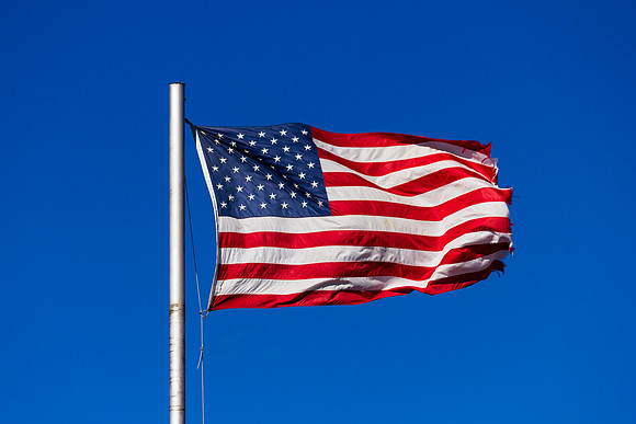 American Flag close-up against blue sky